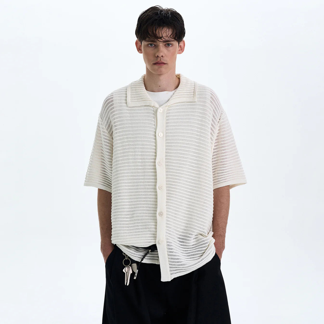 THE OPEN KNIT BUTTON POLO